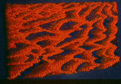Simpson Desert Sunset  1978  Overall 30cm x 25cm.  Freestyle bargello with french knots, wool.  Artist's colection.